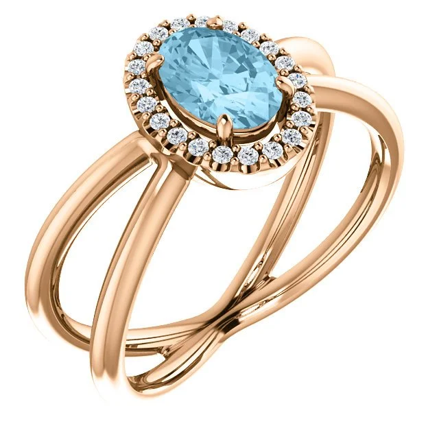 14KT GOLD AQUAMARINE & DIAMOND CRISS-CROSS HALO RING